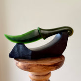 Hand carved large New Zealand Flower Jade knife with koru carving displayed in a Argillite stone stand sculpture. Hand carved here in New Zealand by Ric Moor. This is a 'one only' sculpture, a beautiful display piece.